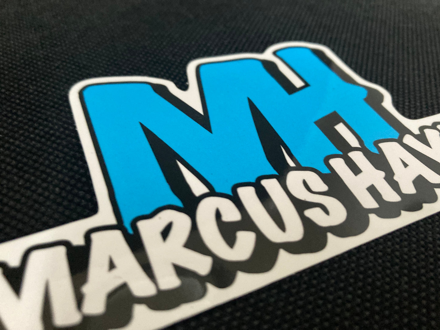 'MARCUS HAYES' logo sticker