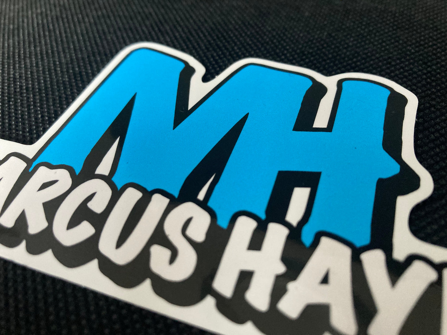 'MARCUS HAYES' logo sticker